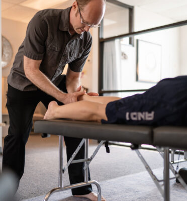 Holistic Chiropractor Dr Jason Dixon working with a patient